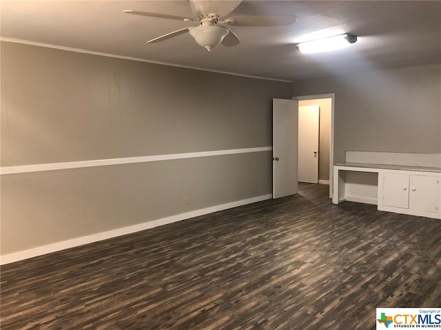 spare room with ceiling fan, crown molding, and dark hardwood / wood-style flooring