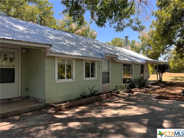 rear view of property featuring a patio