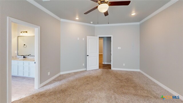 unfurnished bedroom featuring light carpet, ornamental molding, and ceiling fan