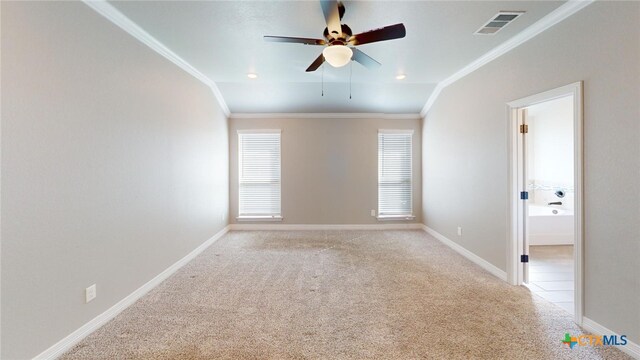 carpeted spare room with crown molding and ceiling fan