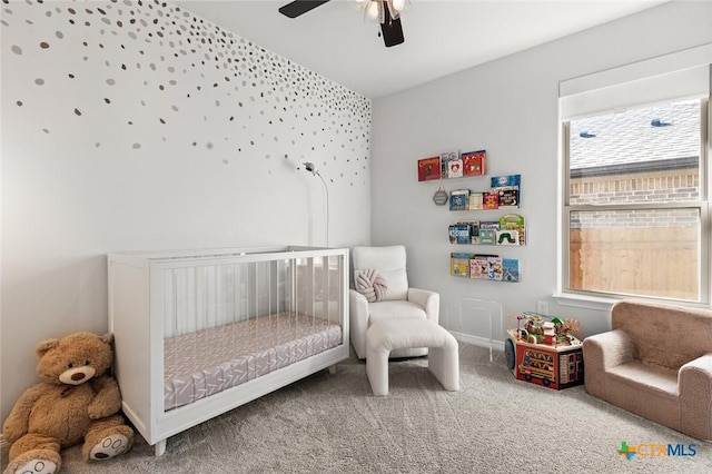 bedroom featuring carpet floors, a ceiling fan, and baseboards