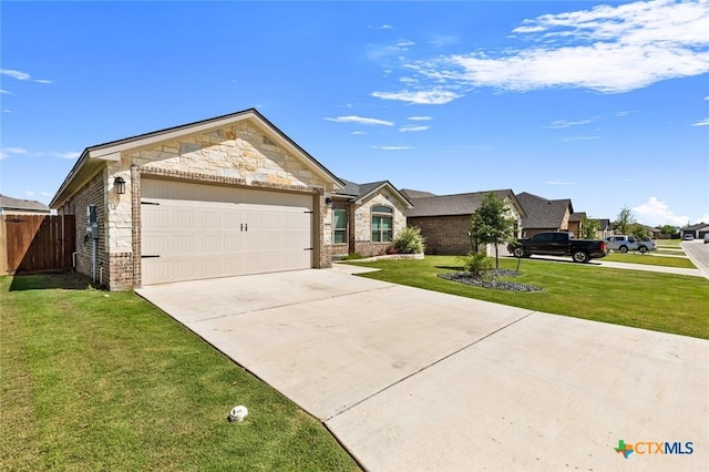 2027 Butternut Rd, Temple, TX 76502 - view of front of home featuring an attached garage, driveway, stone siding, and brick siding