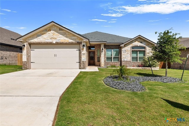 2027 Butternut Rd, Temple, TX 76502 - view of front facade with a garage, stone siding, a front lawn, and concrete driveway