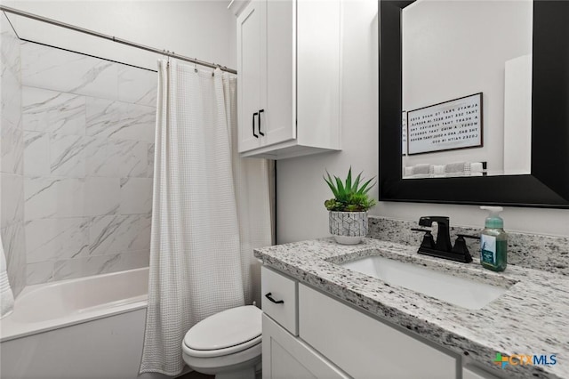 bathroom with shower / tub combo, vanity, and toilet