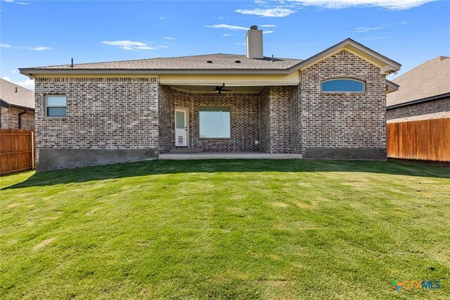 2027 Butternut Rd, Temple, TX 76502 - rear view of house with brick siding, a patio area, ceiling fan, and a chimney