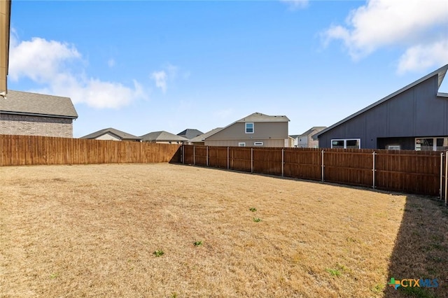 view of yard featuring a fenced backyard