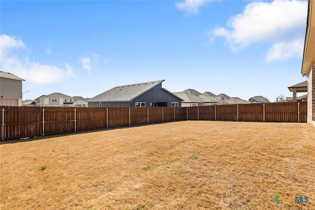 view of yard with a fenced backyard