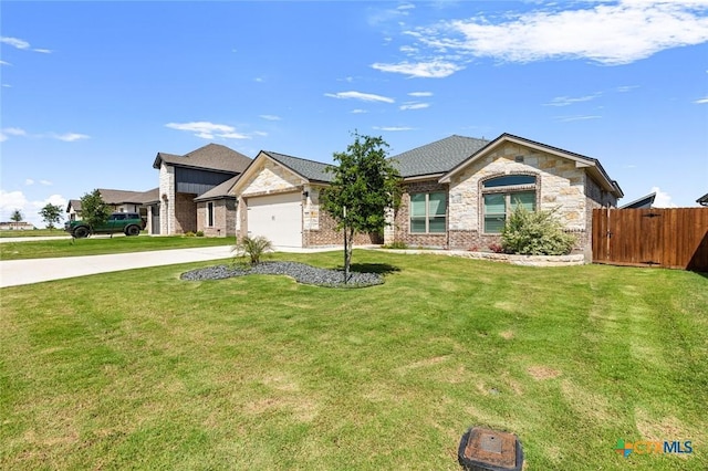 2027 Butternut Rd, Temple, TX 76502 - view of front facade with driveway, stone siding, and an attached garage