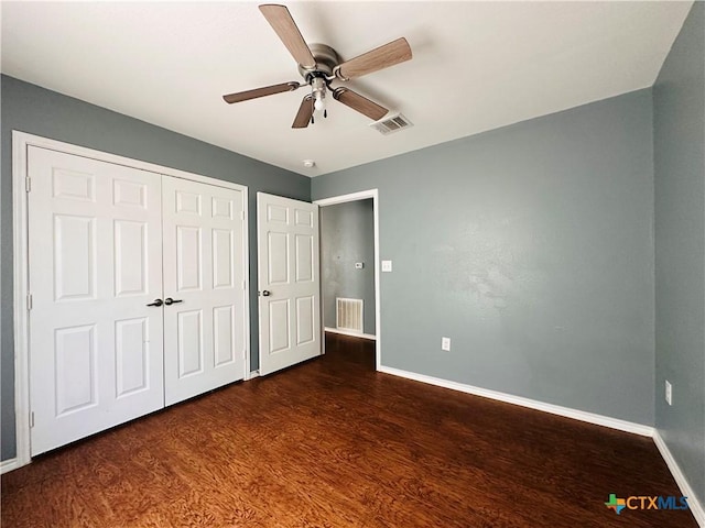 317 Aubrey St, Yoakum, TX 77995 - unfurnished bedroom with baseboards, wood finished floors, a closet, and ceiling fan