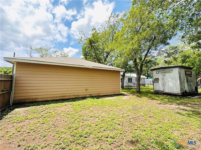 317 Aubrey St, Yoakum, TX 77995 - view of yard featuring a shed and an outbuilding