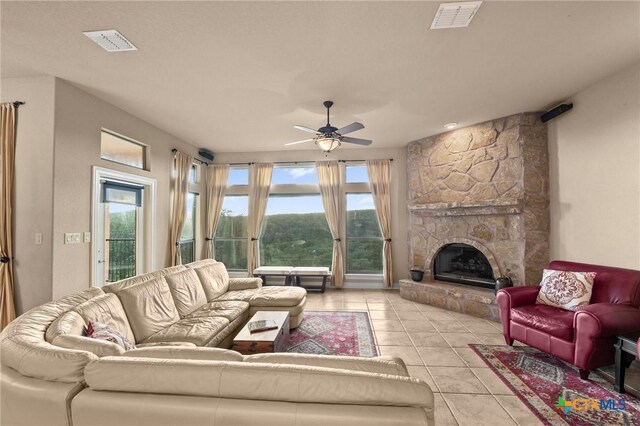 5310 River Oaks Dr, New Braunfels, TX 78132 - living room featuring ceiling fan, light tile patterned flooring, and a fireplace