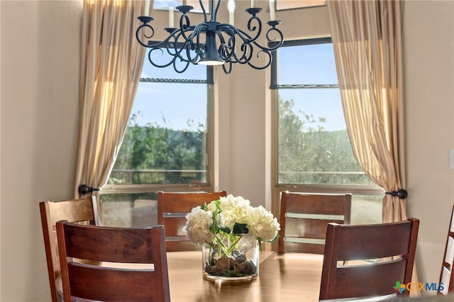 5310 River Oaks Dr, New Braunfels, TX 78132 - dining space featuring a chandelier and healthy amount of natural light
