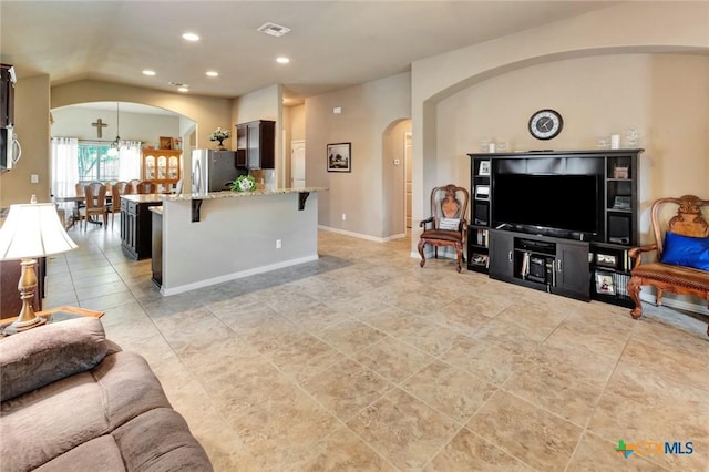 106 Cobble Stone Ct, Victoria, TX 77904 - living area with arched walkways, recessed lighting, a chandelier, vaulted ceiling, and light tile patterned floors