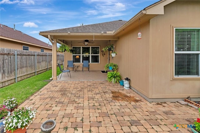 106 Cobble Stone Ct, Victoria, TX 77904 - fenced backyard featuring a ceiling fan and a patio area
