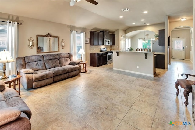 106 Cobble Stone Ct, Victoria, TX 77904 - living room featuring arched walkways, a ceiling fan, light tile patterned flooring, vaulted ceiling, and recessed lighting