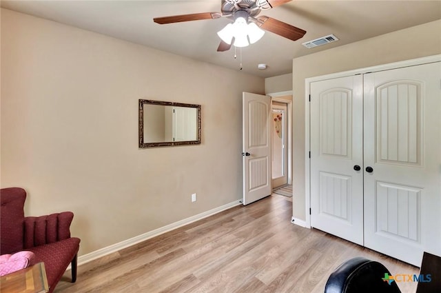 106 Cobble Stone Ct, Victoria, TX 77904 - living area with light wood finished floors, ceiling fan, and baseboards
