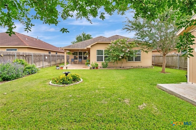 106 Cobble Stone Ct, Victoria, TX 77904 - back of property featuring a patio area and stucco siding