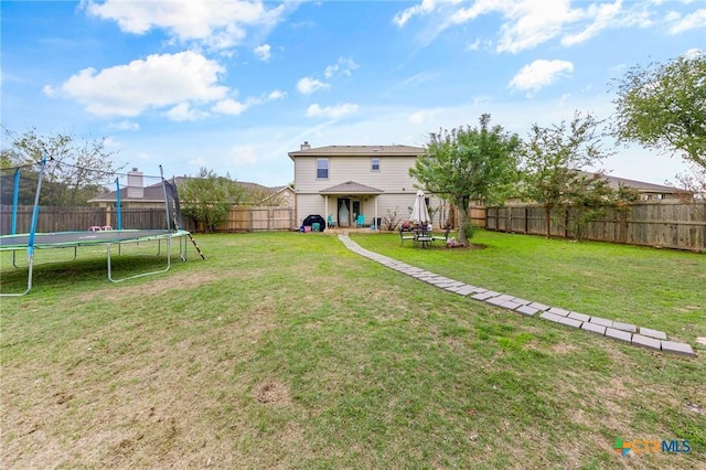 view of yard featuring a trampoline