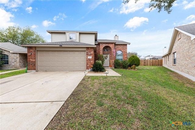 view of front of house featuring a garage and a front yard