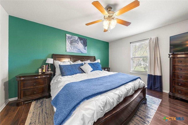 bedroom featuring ceiling fan and dark hardwood / wood-style flooring