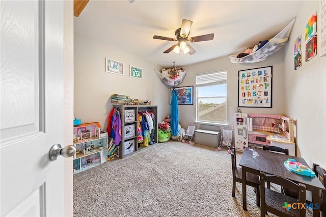 playroom featuring carpet and ceiling fan