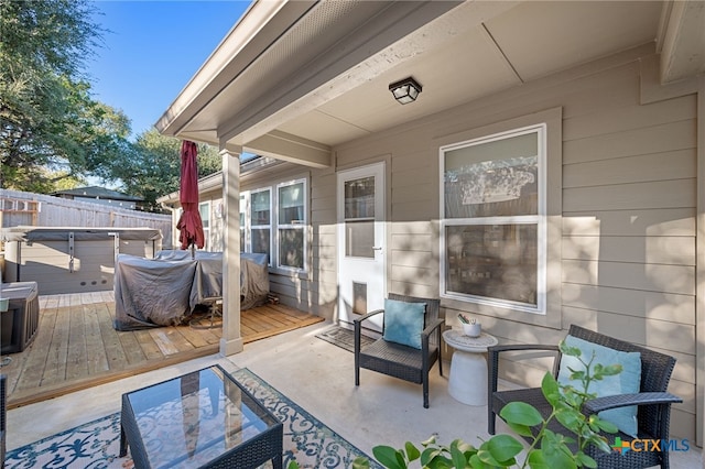 2803 American Dr, Lago Vista, TX 78645 - view of patio with fence, a wooden deck, and a hot tub