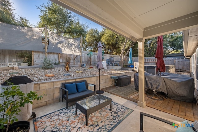 2803 American Dr, Lago Vista, TX 78645 - view of patio with an outdoor living space, a fenced backyard, and a deck