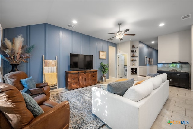 2803 American Dr, Lago Vista, TX 78645 - living area featuring a ceiling fan, visible vents, lofted ceiling, and a decorative wall