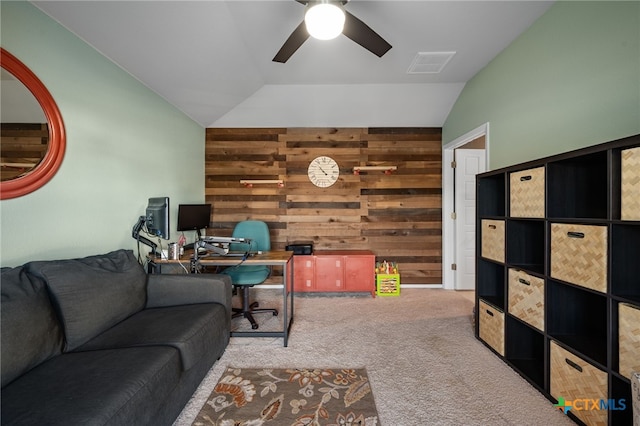 2803 American Dr, Lago Vista, TX 78645 - carpeted living room with a ceiling fan, wood walls, visible vents, and lofted ceiling
