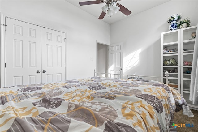 carpeted bedroom featuring a closet and ceiling fan