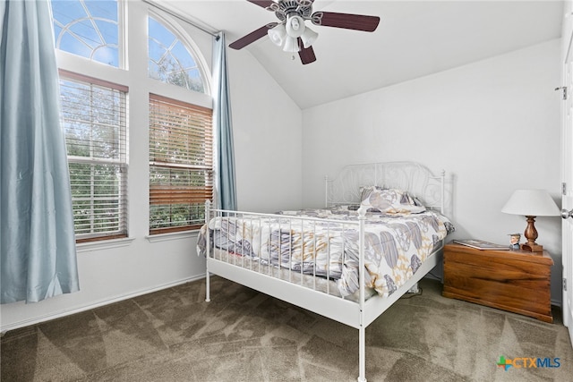 bedroom featuring ceiling fan, carpet flooring, and lofted ceiling