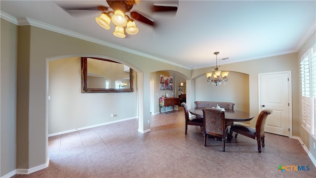 dining space featuring crown molding and ceiling fan with notable chandelier