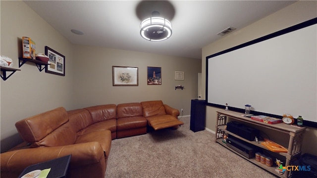 home theater featuring light colored carpet