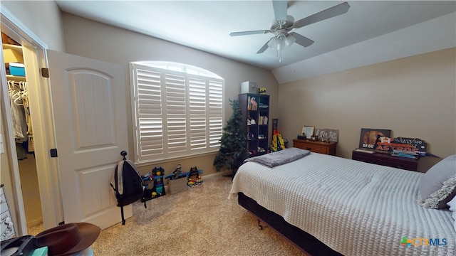 bedroom featuring ceiling fan, light colored carpet, and vaulted ceiling