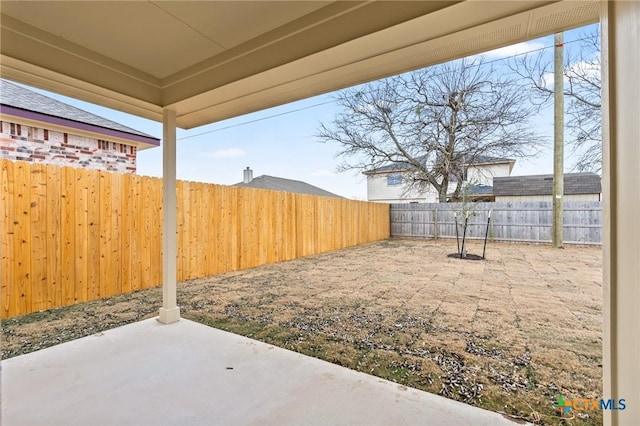 view of yard with a patio area and a fenced backyard