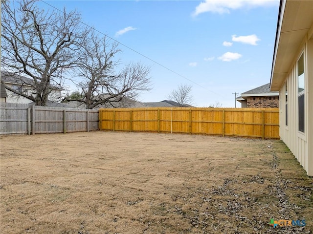 view of yard featuring a fenced backyard