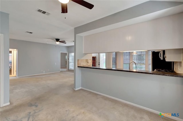 218 Sunset Dr, Victoria, TX 77901 - unfurnished living room with a ceiling fan and carpet floors