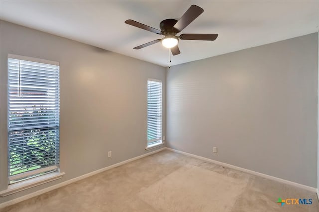 218 Sunset Dr, Victoria, TX 77901 - unfurnished room featuring light carpet and a ceiling fan