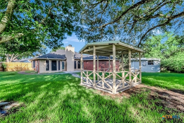 218 Sunset Dr, Victoria, TX 77901 - back of house featuring a chimney
