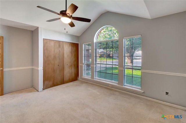 218 Sunset Dr, Victoria, TX 77901 - unfurnished bedroom with vaulted ceiling, carpet flooring, a closet, and a ceiling fan