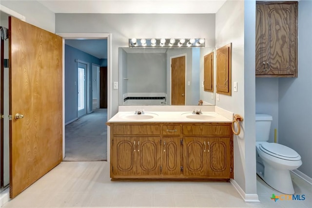 218 Sunset Dr, Victoria, TX 77901 - full bathroom featuring toilet and double vanity