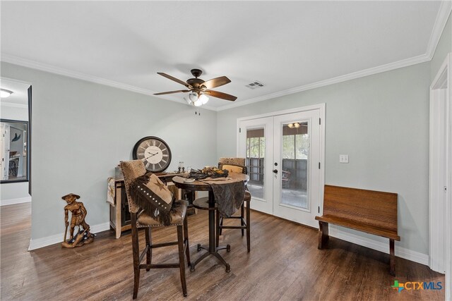 dining space featuring french doors, dark hardwood / wood-style flooring, ceiling fan, and crown molding