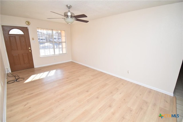 entryway featuring light hardwood / wood-style floors and ceiling fan