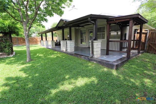 exterior space with a patio and a fenced backyard