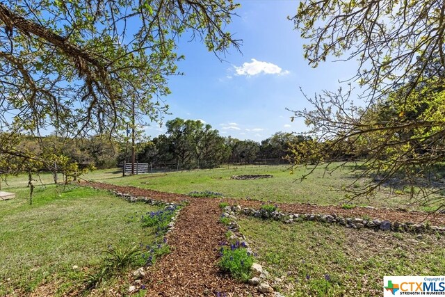 view of yard with a rural view