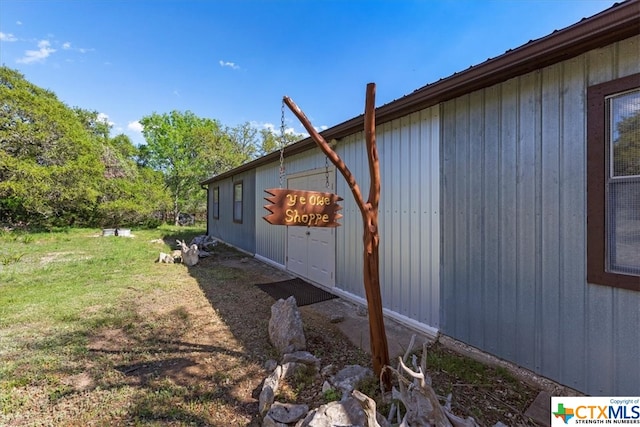 view of home's exterior featuring a yard