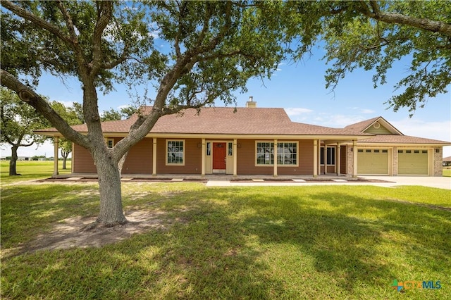 99 N Seakist Ln, Port Lavaca, TX 77979 - ranch-style house featuring a garage, a front lawn, driveway, covered porch, and a chimney