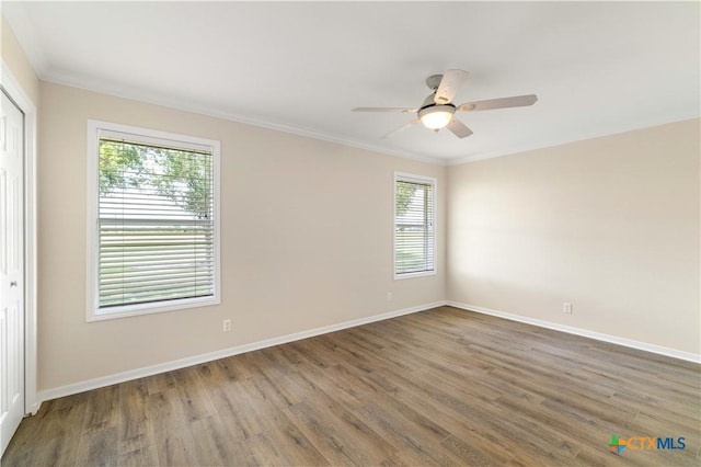 99 N Seakist Ln, Port Lavaca, TX 77979 - spare room with wood finished floors, ceiling fan, and ornamental molding