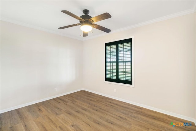 99 N Seakist Ln, Port Lavaca, TX 77979 - spare room featuring wood finished floors, ornamental molding, and ceiling fan