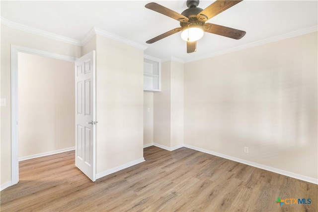 99 N Seakist Ln, Port Lavaca, TX 77979 - empty room with light wood-type flooring, ornamental molding, and ceiling fan